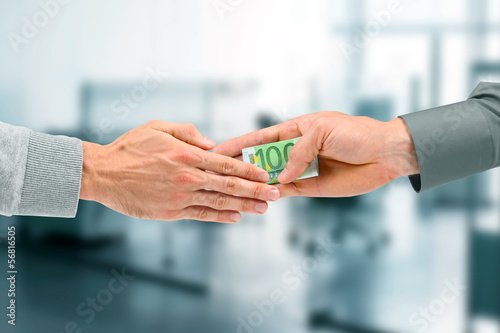 Photo: corruption concept - businessman giving a bribe corruption concept - businessman giving a bribe