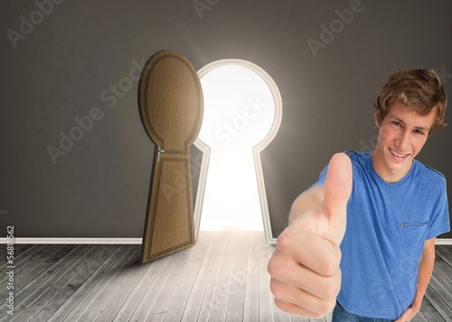 Photo: Male attractive student showing thumb up Male attractive student showing thumb up