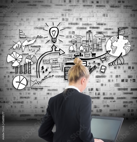 Photo: Blonde businesswoman using laptop Blonde businesswoman using laptop