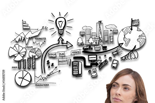 Photo: Concentrated pretty brunette looking at illustrations Concentrated pretty brunette looking at illustrations