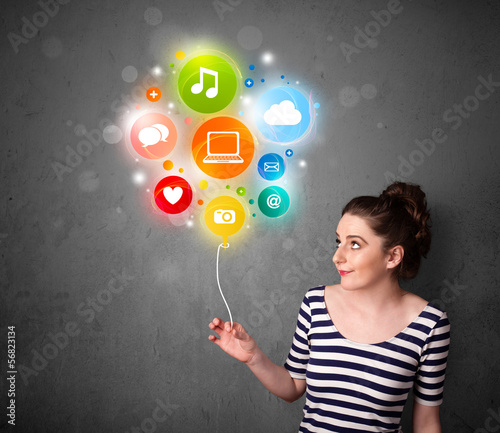 Photo: Woman holding social media balloon Woman holding social media balloon