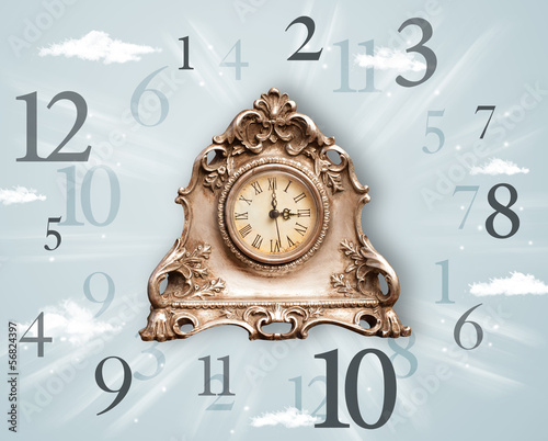 Photo: Vintage clock with numbers on the side Vintage clock with numbers on the side