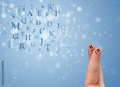Photo: Happy smiley fingers looking at mixture of bokeh letters Happy smiley fingers looking at mixture of bokeh letters