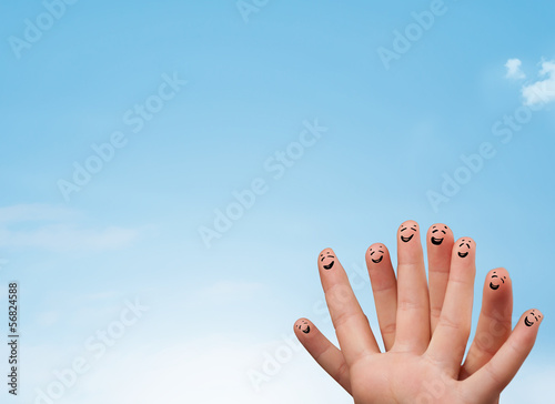Photo: Happy smiley fingers looking at clear blue sky copyspace Happy smiley fingers looking at clear blue sky copyspace