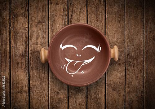 Photo: Happy smiley cartoon face on colorful dish plate Happy smiley cartoon face on colorful dish plate