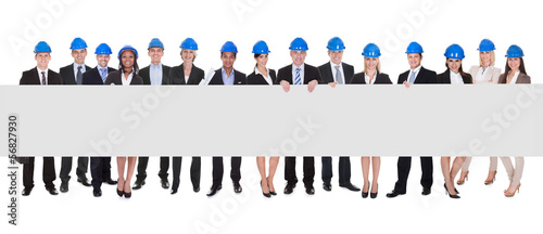 Photo: Group Of Architects With Blank Placard Group Of Architects With Blank Placard
