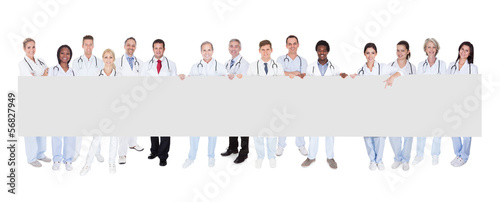 Photo: Group Of Doctors With Placard Group Of Doctors With Placard