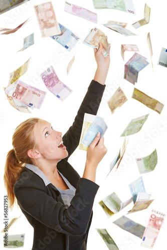 Photo: Business woman catching flying Euro money Business woman catching flying Euro money