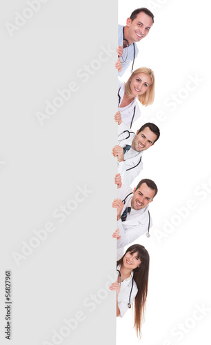 Photo: Group Of Doctors Holding Placard Group Of Doctors Holding Placard