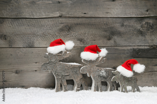 Photo: Rentier Familie als weihnachtliche Grußkarte mit Holz Rentier Familie als weihnachtliche Grußkarte mit Holz
