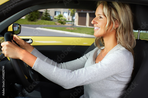 Photo: Woman car driver. Woman car driver.