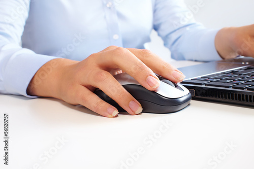 Photo: Hands with laptop computer keyboard. Hands with laptop computer keyboard.
