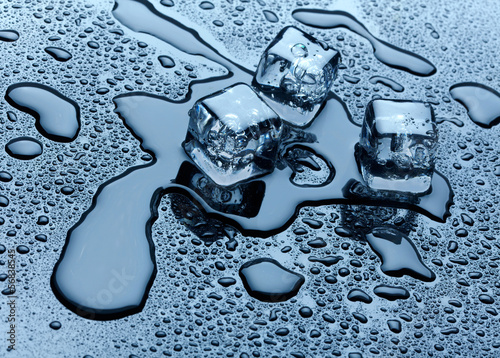 Photo: Ice cubes over dark background Ice cubes over dark background