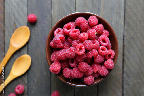 Photo: red delicious raspberry on the table red delicious raspberry on the table