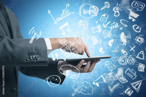 Photo: Businessman working with tablet and social media Businessman working with tablet and social media