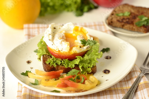 Photo: Poached egg on toast with vegetables Poached egg on toast with vegetables