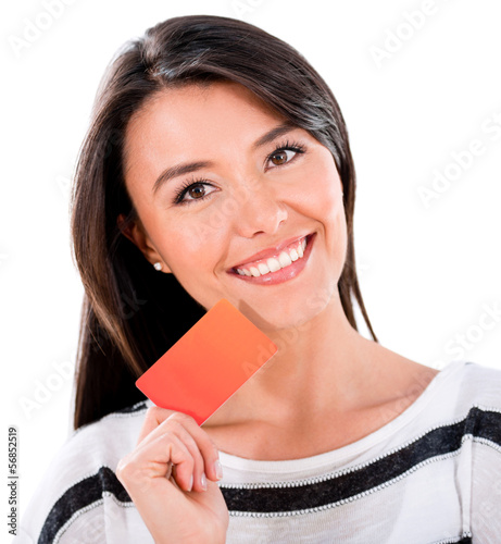 Photo: Woman holding a credit card Woman holding a credit card