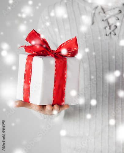 Photo: man holding a gift box man holding a gift box