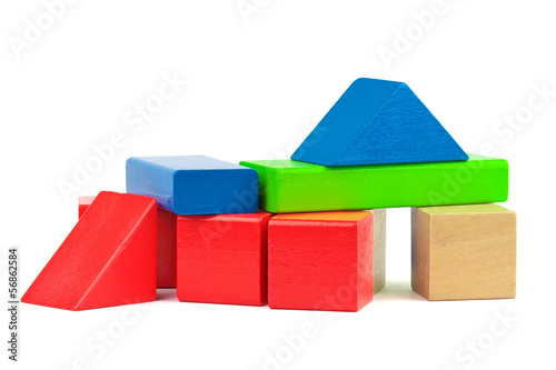 Photo: Wooden toy colorful bricks isolated on white background. Wooden toy colorful bricks isolated on white background.