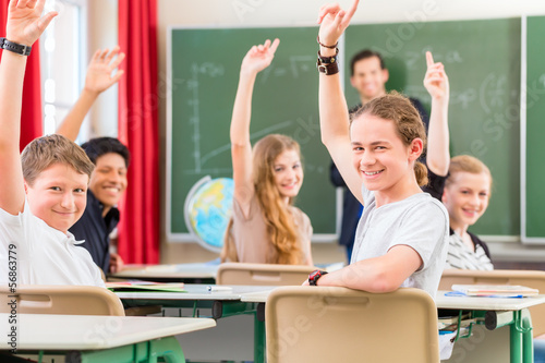 Photo: Teacher educate or teaching a class of pupils in school Teacher educate or teaching a class of pupils in school