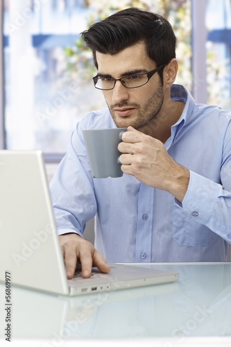 Photo: Businessman working at desk Businessman working at desk