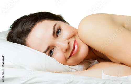 Photo: Content smiling woman in bed Content smiling woman in bed