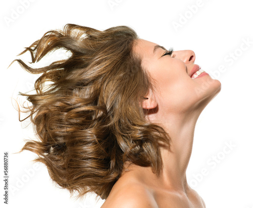 Photo: Beauty Smiling Young Woman Portrait over White Background Beauty Smiling Young Woman Portrait over White Background