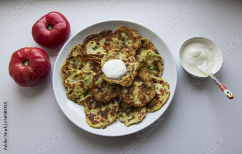 Photo: potato pancakes and tomatoes potato pancakes and tomatoes