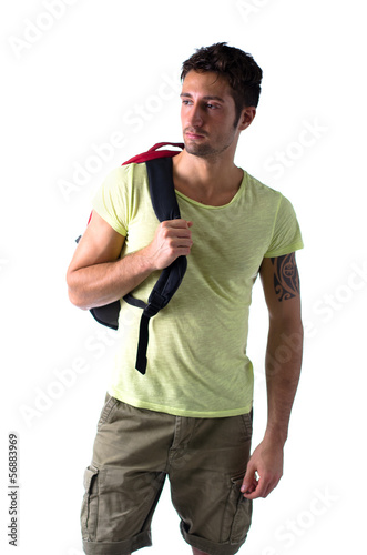 Photo: Handsome young man with backpack, isolated on white Handsome young man with backpack, isolated on white