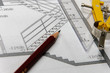 stift und zirkel auf einem bauplan stift und zirkel auf einem bauplan