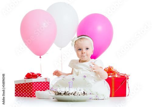 Photo: cute kid girl eating birthday cake cute kid girl eating birthday cake