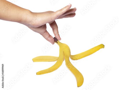 Photo: mano con buccia di banana mano con buccia di banana