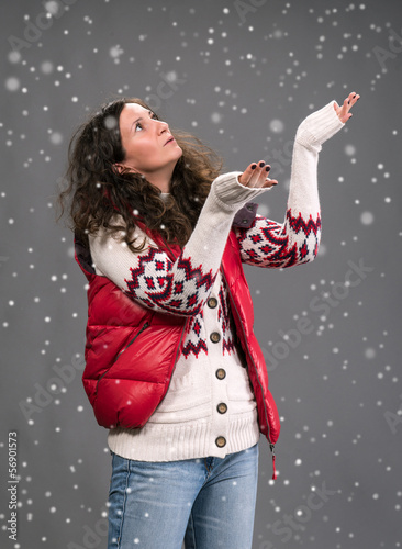 Photo: Woman in warm clothing with snow Woman in warm clothing with snow