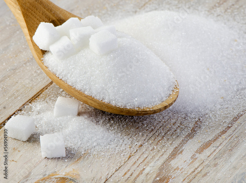Photo: sugar on wooden table sugar on wooden table