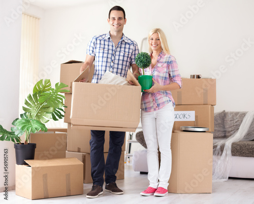 Photo: Cheerful couple their new home Cheerful couple their new home