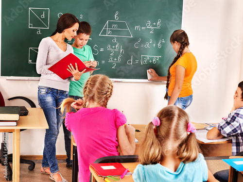 Photo: School child with teacher. School child with teacher.