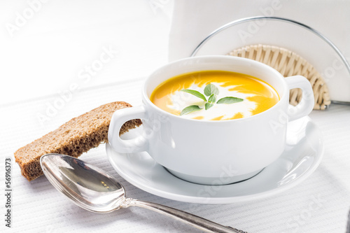 Photo: Pumpkin soup on served table Pumpkin soup on served table