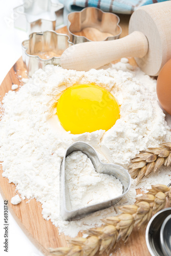 Photo: flour, eggs, rolling pin and baking forms, top view flour, eggs, rolling pin and baking forms, top view