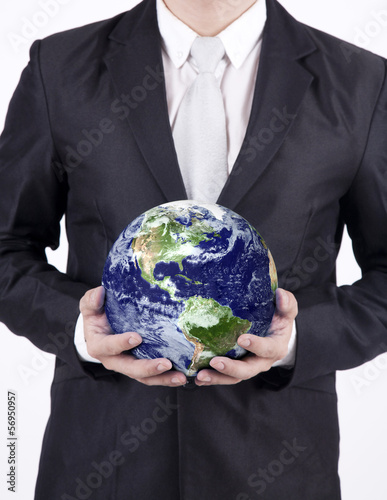 Photo: Close-up businessman hold globe - isolated Close-up businessman hold globe - isolated