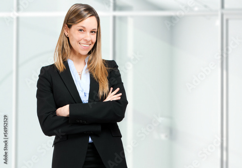 Photo: Young businesswoman portrait in her office Young businesswoman portrait in her office