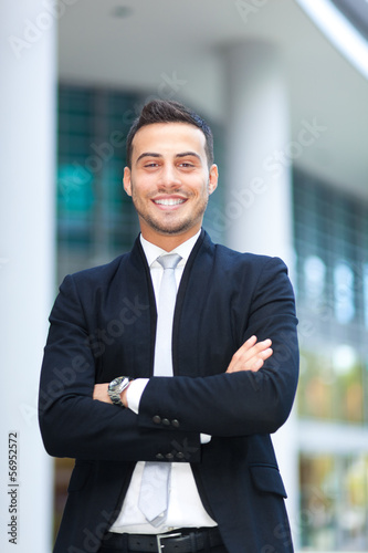 Photo: Young businessman portrait in an urban setting Young businessman portrait in an urban setting