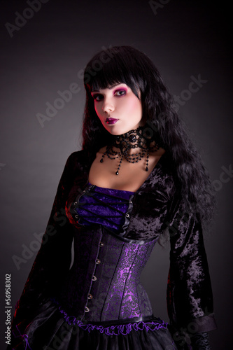 Photo: Portrait of beautiful gothic girl wearing Halloween costume Portrait of beautiful gothic girl wearing Halloween costume