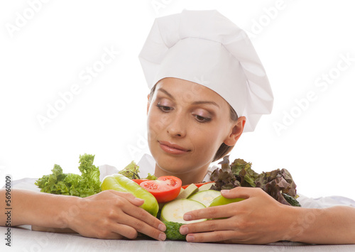Photo: woman chef or cook and vegetables woman chef or cook and vegetables