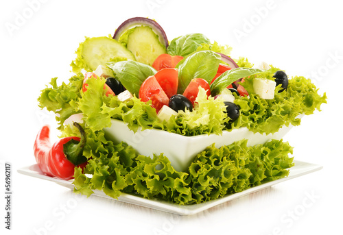 Photo: Vegetable salad bowl isolated on white Vegetable salad bowl isolated on white