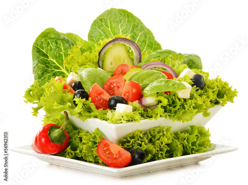 Photo: Vegetable salad bowl isolated on white Vegetable salad bowl isolated on white