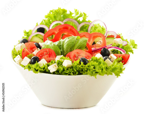 Photo: Vegetable salad bowl isolated on white Vegetable salad bowl isolated on white