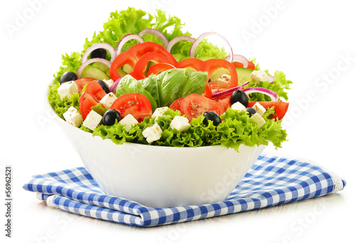 Photo: Vegetable salad bowl isolated on white Vegetable salad bowl isolated on white