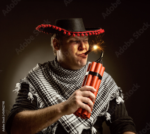 Photo: Cowboy mexican firing dynamite by cigar Cowboy mexican firing dynamite by cigar