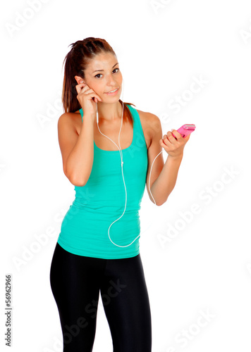 Photo: Young woman listening music with her cell phone Young woman listening music with her cell phone