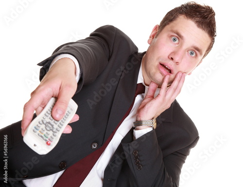 Photo: man with remote control changing channel man with remote control changing channel